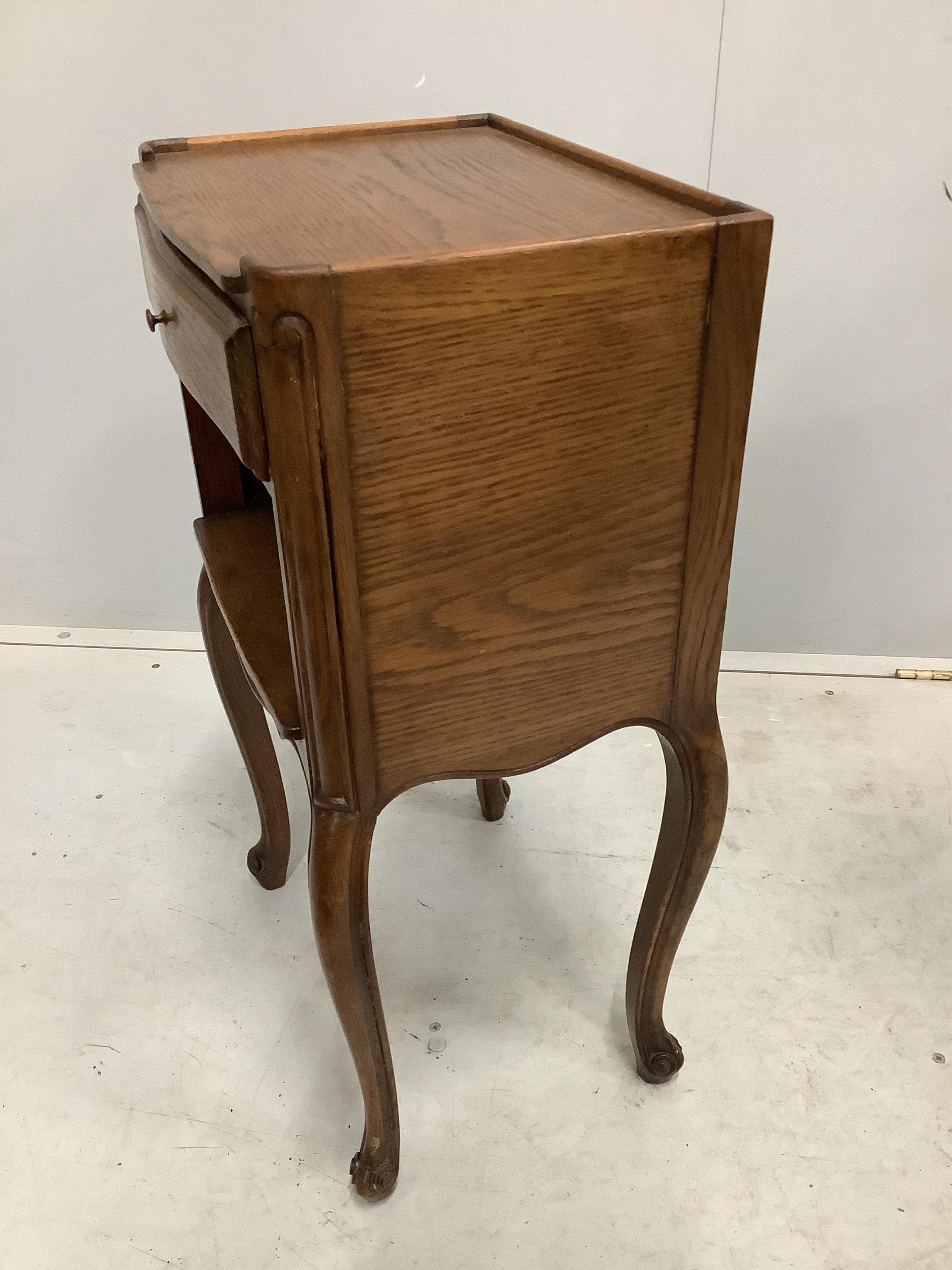 A pair of French oak bedside cabinets, width 38cm, depth 28cm, height 70cm. Condition - fair to good